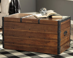 Tampa Furniture Outlet Lutz - Ashley Furniture - Kettleby Storage Trunk - Storage Trunk / Brown - A4000096