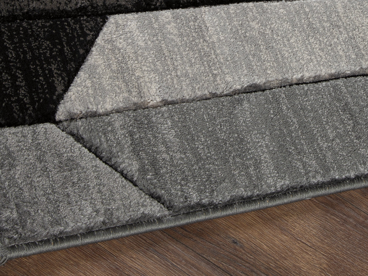 Tampa Furniture Outlet Lutz - Ashley Furniture - Chayse Rug - 5' x 6'7" Rug / Black/Gray - R403462