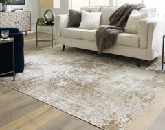 Tampa Furniture Outlet Lutz - Ashley Furniture - Grifflain Rug - 7'10" x 10'3" Washable Rug / Tan/Brown/Gray - R406231