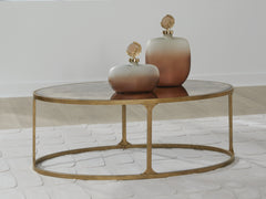 Tampa Furniture Outlet Lutz - Ashley Furniture - Korajane Coffee Table - Oval Cocktail Table / Antique Gold - T399-0