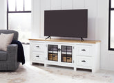 Tampa Furniture Outlet Lutz - Ashley Furniture - Ashbryn 74" TV Stand - 74" / White/Natural - W844-68