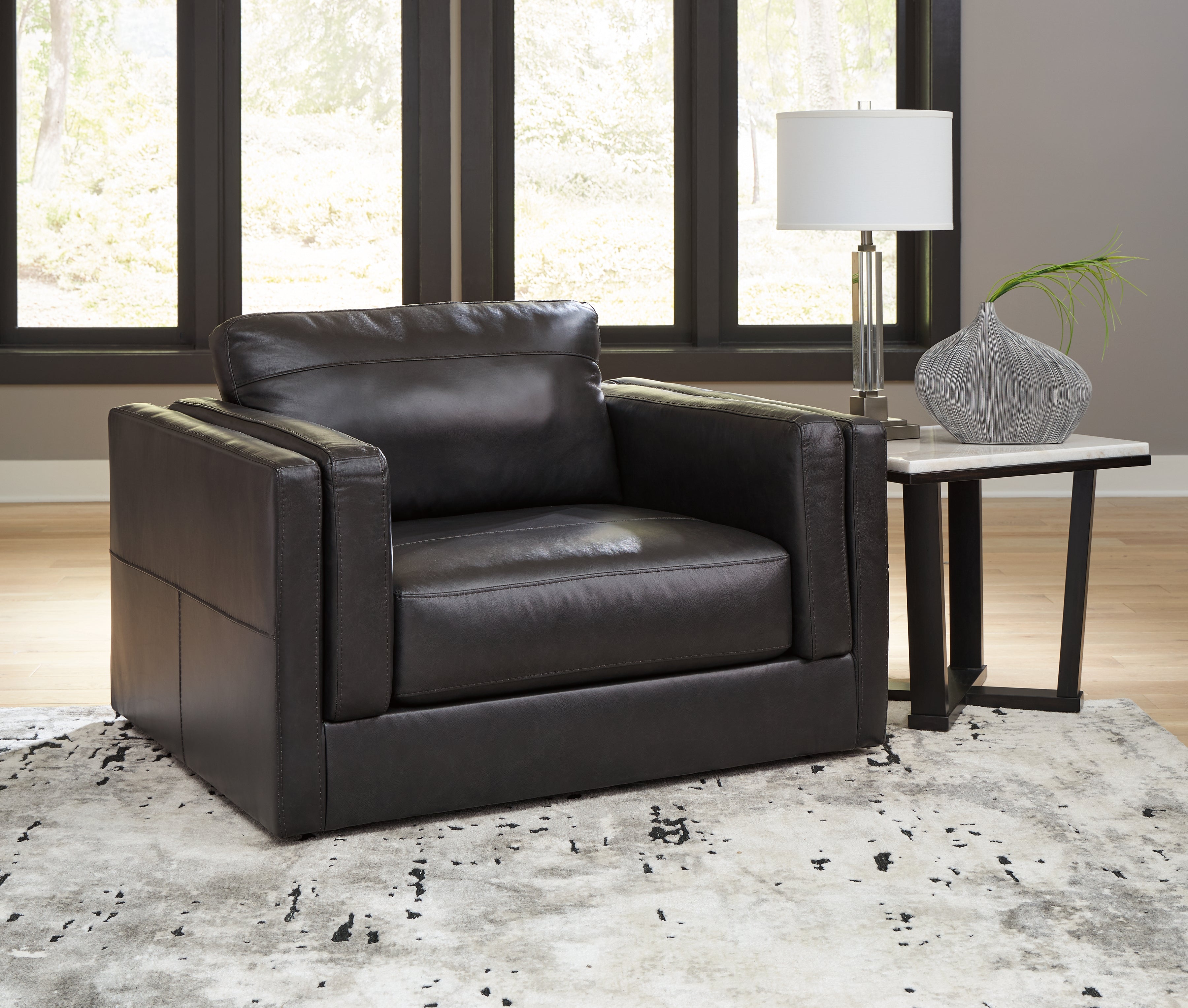 Tampa Furniture Outlet Lutz - Ashley Furniture - Amiata Living Room - Chair and a Half / Onyx - 5740523