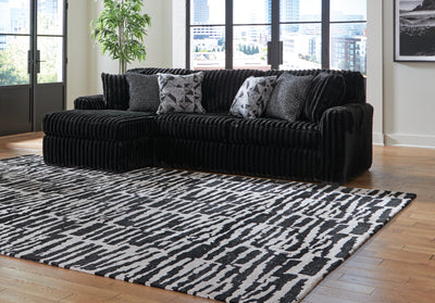 Tampa Furniture Outlet Lutz - Ashley Furniture - Midnight-Madness Sectional - RAF 2-Piece Sectional Sofa with Chaise / Onyx - 98103S1