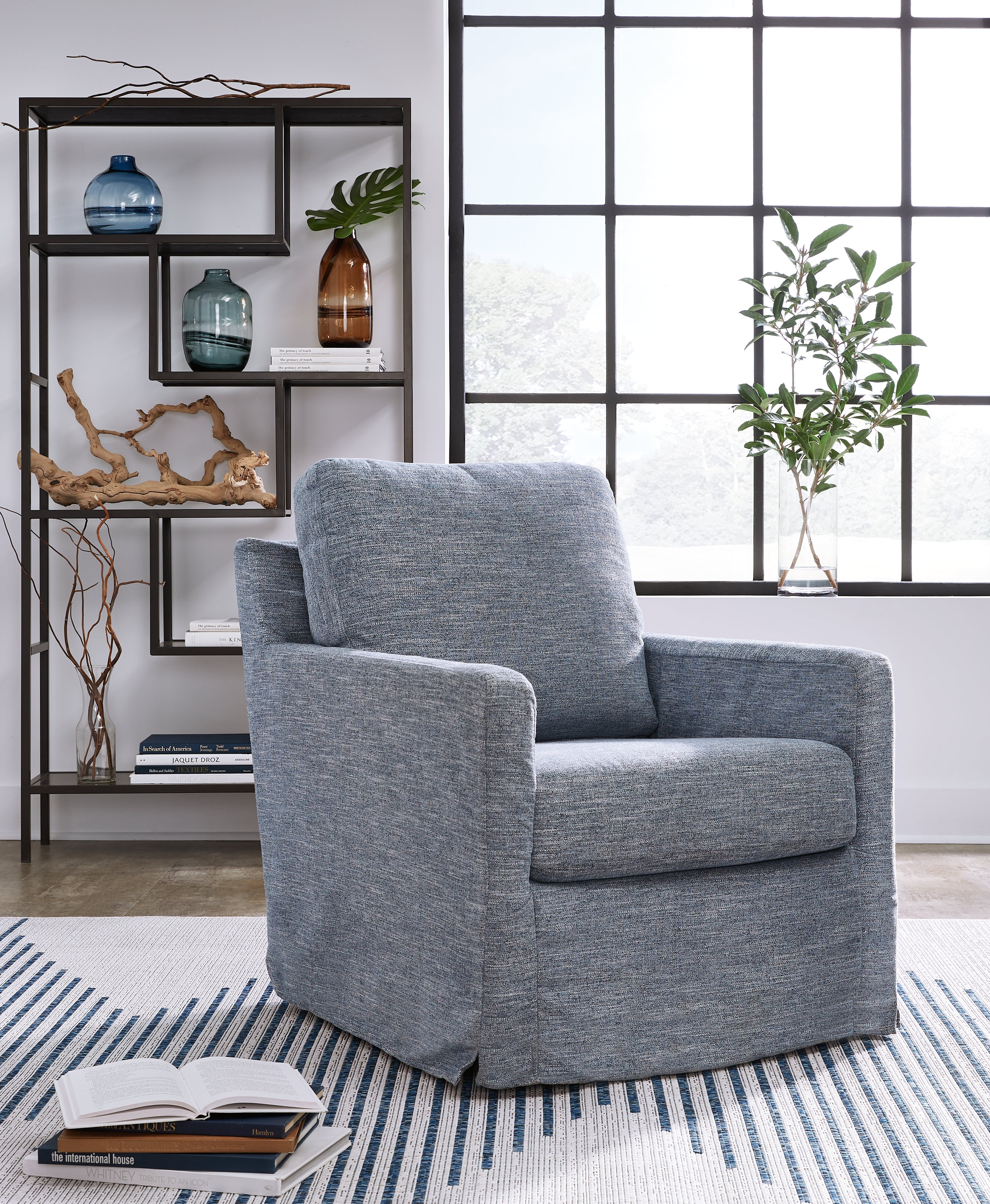 Tampa Furniture Outlet Lutz - Ashley Furniture - Nenana Next-Gen Nuvella Swivel Glider Accent Chair - Swivel Glider Accent Chair / Denim - A3000646