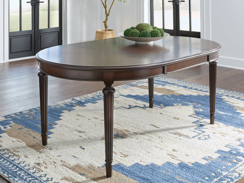 Tampa Furniture Outlet Lutz - Ashley Furniture - Lavinton Dining Room - Oval Dining Room EXT Table / Brown - D764-35