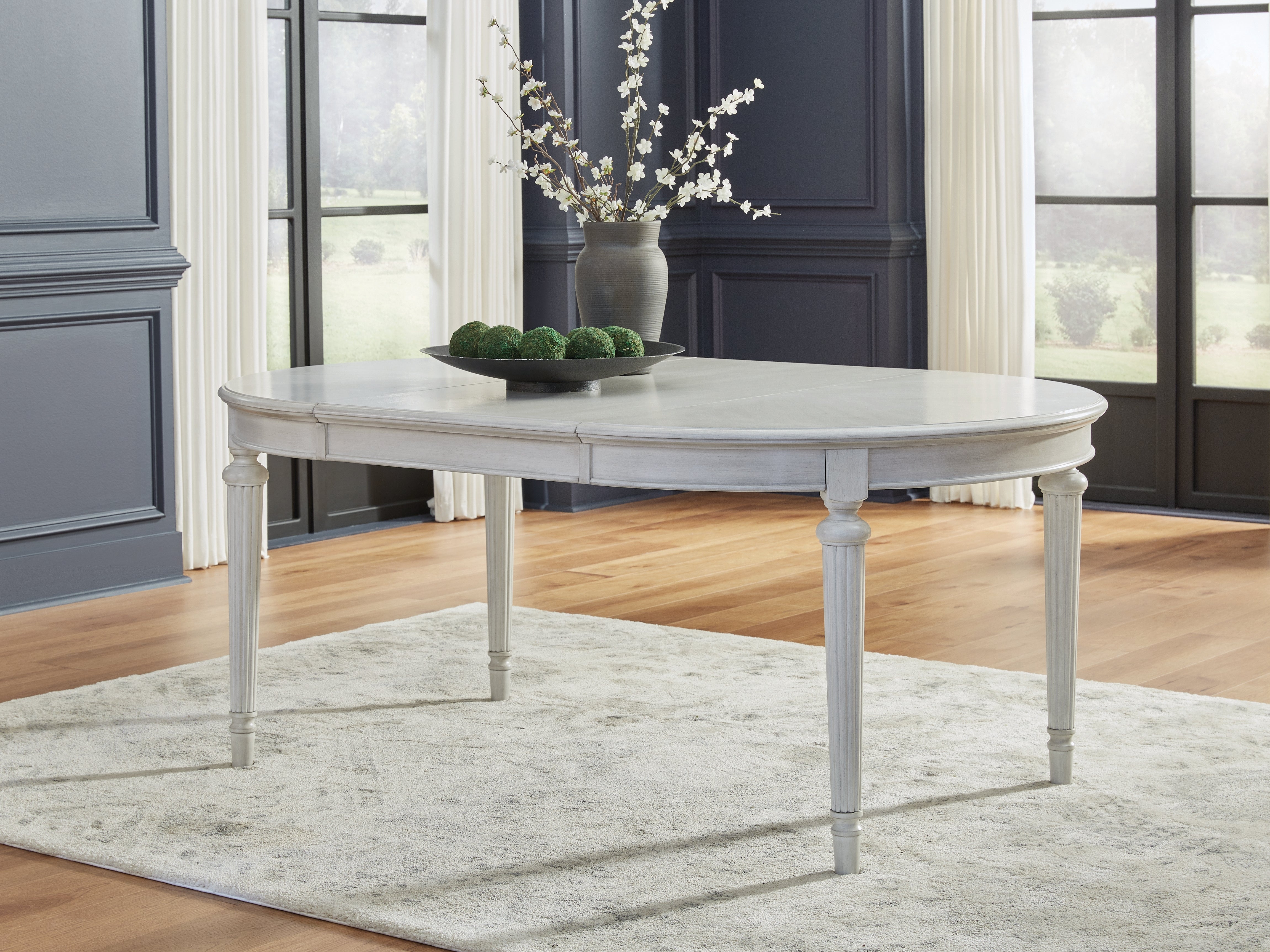 Tampa Furniture Outlet Lutz - Ashley Furniture - Montelaine Dining Room - Oval Dining Room EXT Table / Antique White - D795-35
