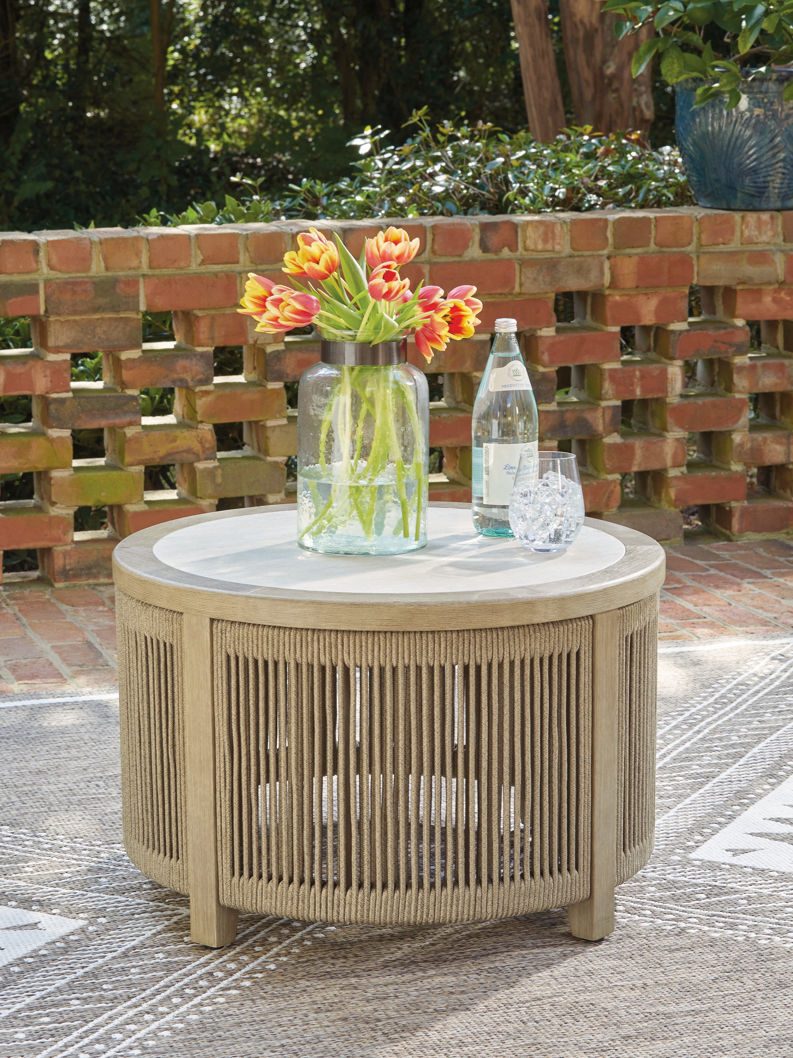 Tampa Furniture Outlet Lutz - Ashley Furniture - Spooners Cove Outdoor - Round Cocktail Table / Beige - PCP469-708