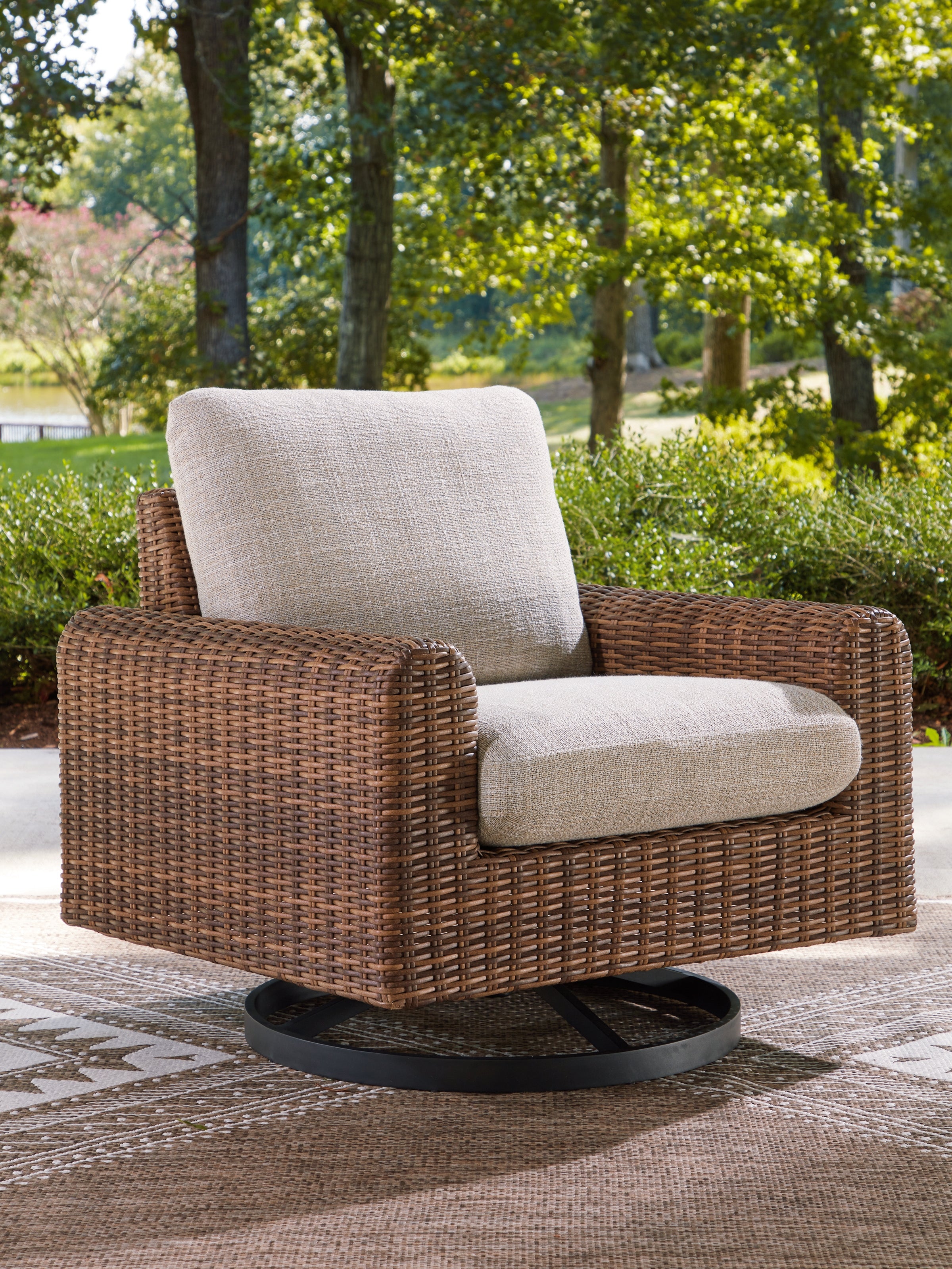 Tampa Furniture Outlet Lutz - Ashley Furniture - Dolan Creek Outdoor - Swivel Lounge w/ Cushion / Gray/Brown - PCP610-821