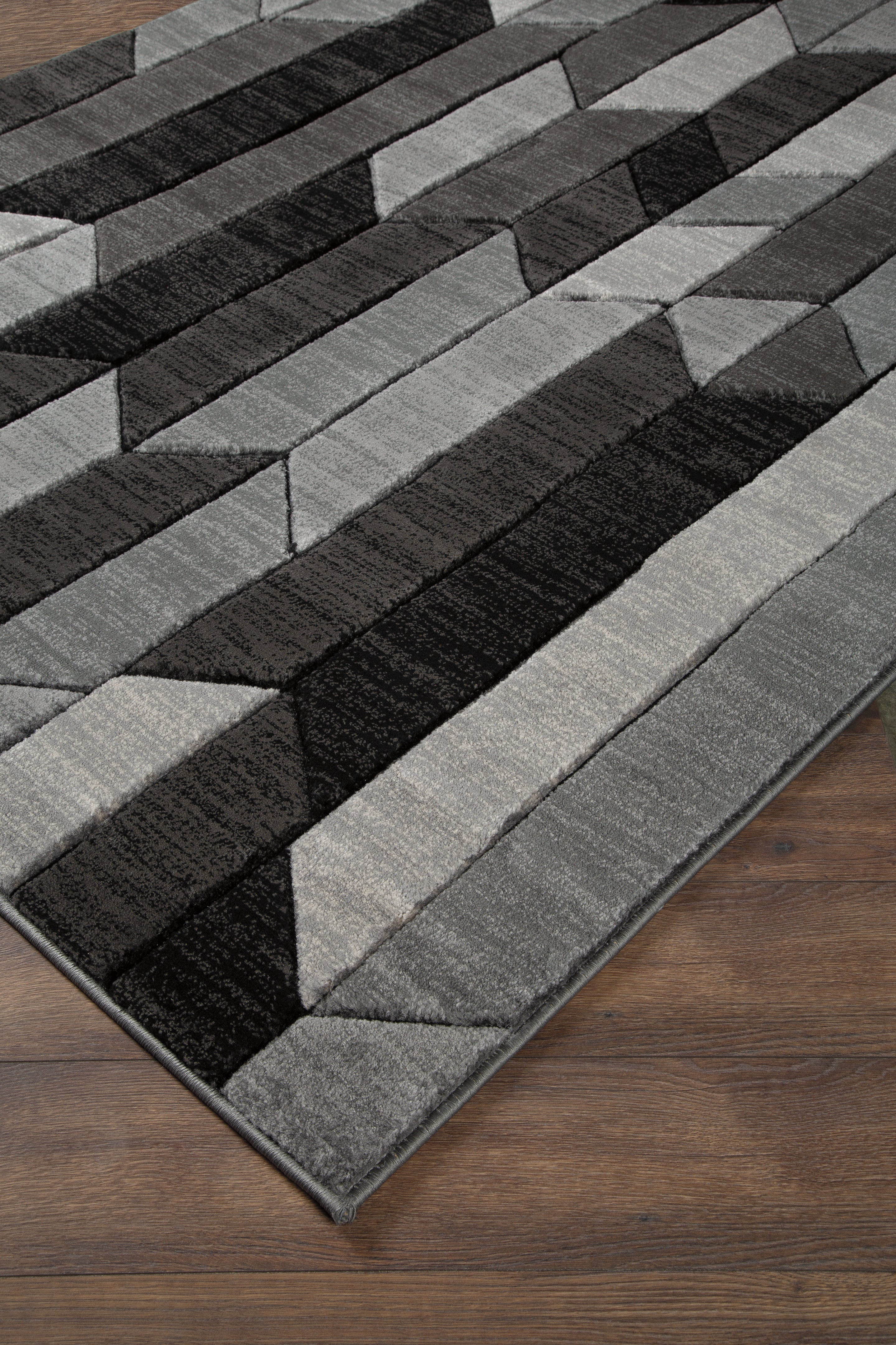 Tampa Furniture Outlet Lutz - Ashley Furniture - Chayse Rug - 6'6" x 9'6" Rug / Black/Gray - R403461