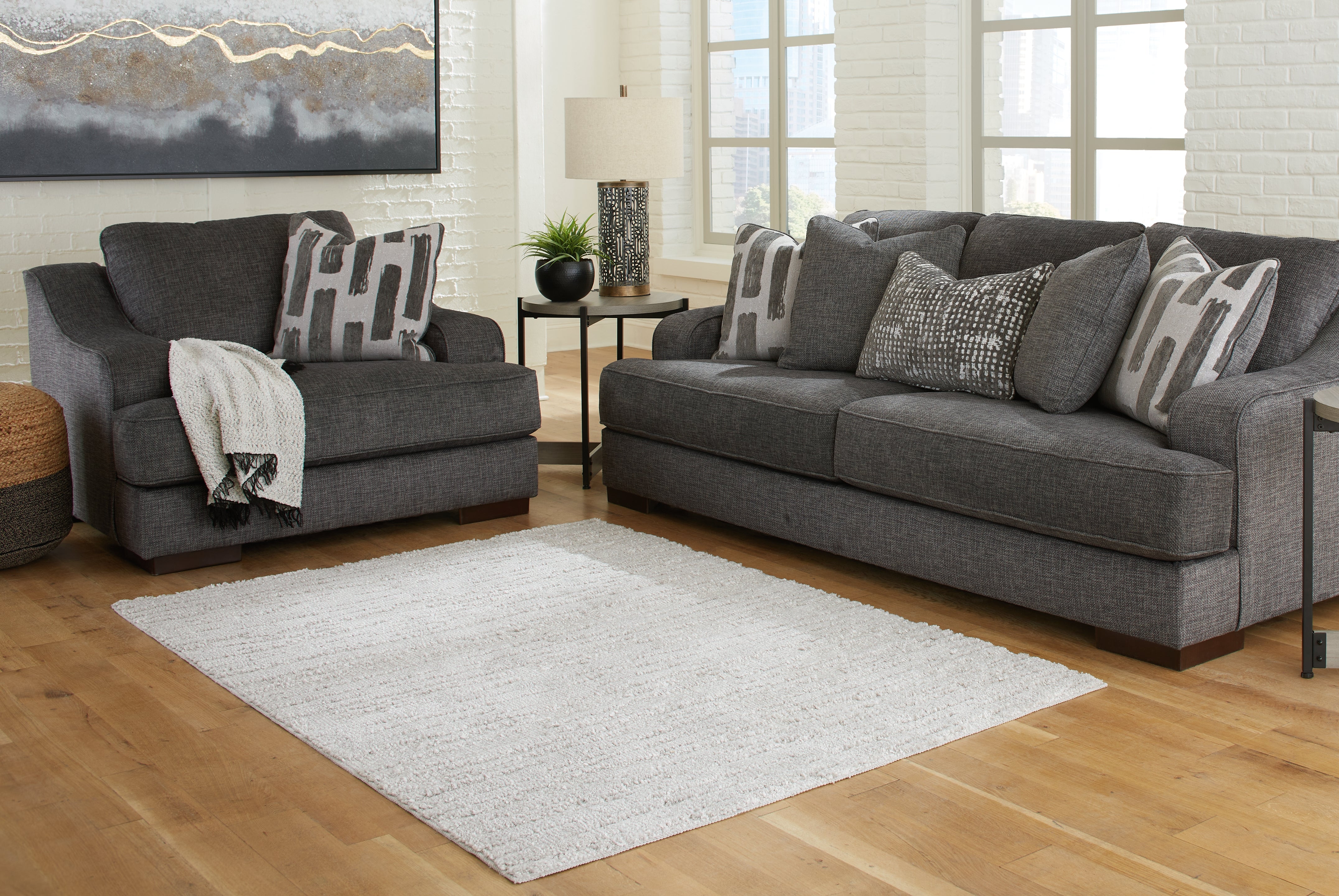 Tampa Furniture Outlet Lutz - Ashley Furniture - Ivygail Rug - 5' x 7' Rug / Gray - R404512