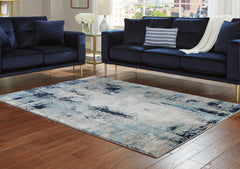 Tampa Furniture Outlet Lutz - Ashley Furniture - Leonelle Rug - 7'10" x 10' Rug / White/Blue/Gray - R404871