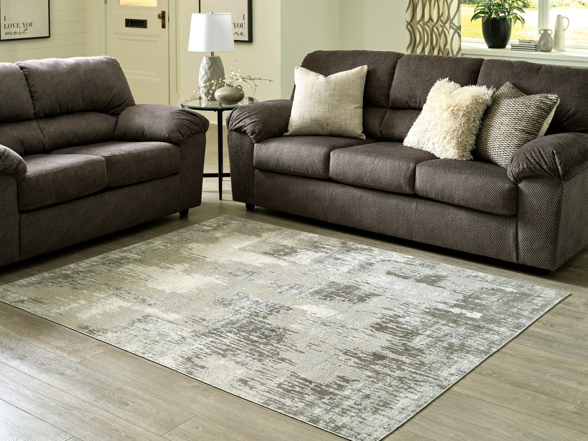 Tampa Furniture Outlet Lutz - Ashley Furniture - Arriston Rug - 7'10" x 10' Washable Rug / Multi - R405561