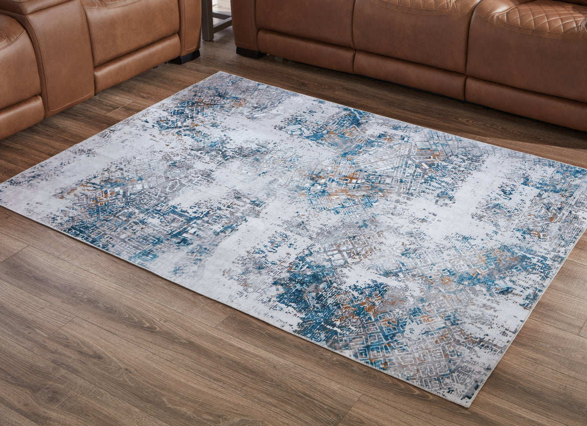 Tampa Furniture Outlet Lutz - Ashley Furniture - Garyard Rug - 5' x 7' Washable Rug / Multi - R405772