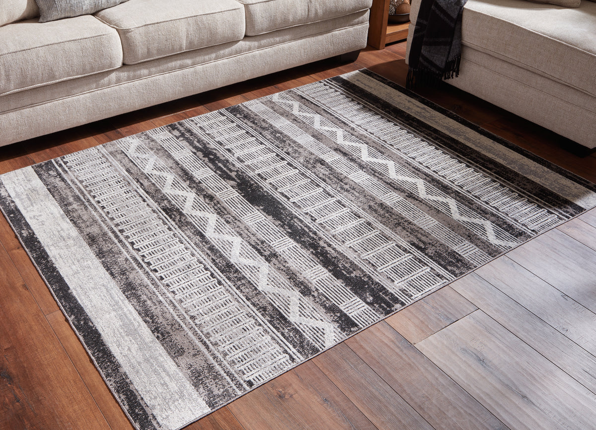 Tampa Furniture Outlet Lutz - Ashley Furniture - Henchester Rug - 5' x 7' Washable Rug / Multi - R405992