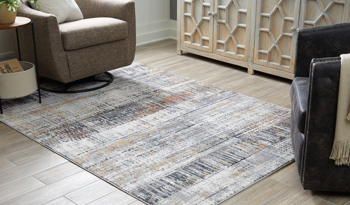Tampa Furniture Outlet Lutz - Ashley Furniture - Rhettner Rug - 5'3" x 7'3" Rug / Multi - R406072