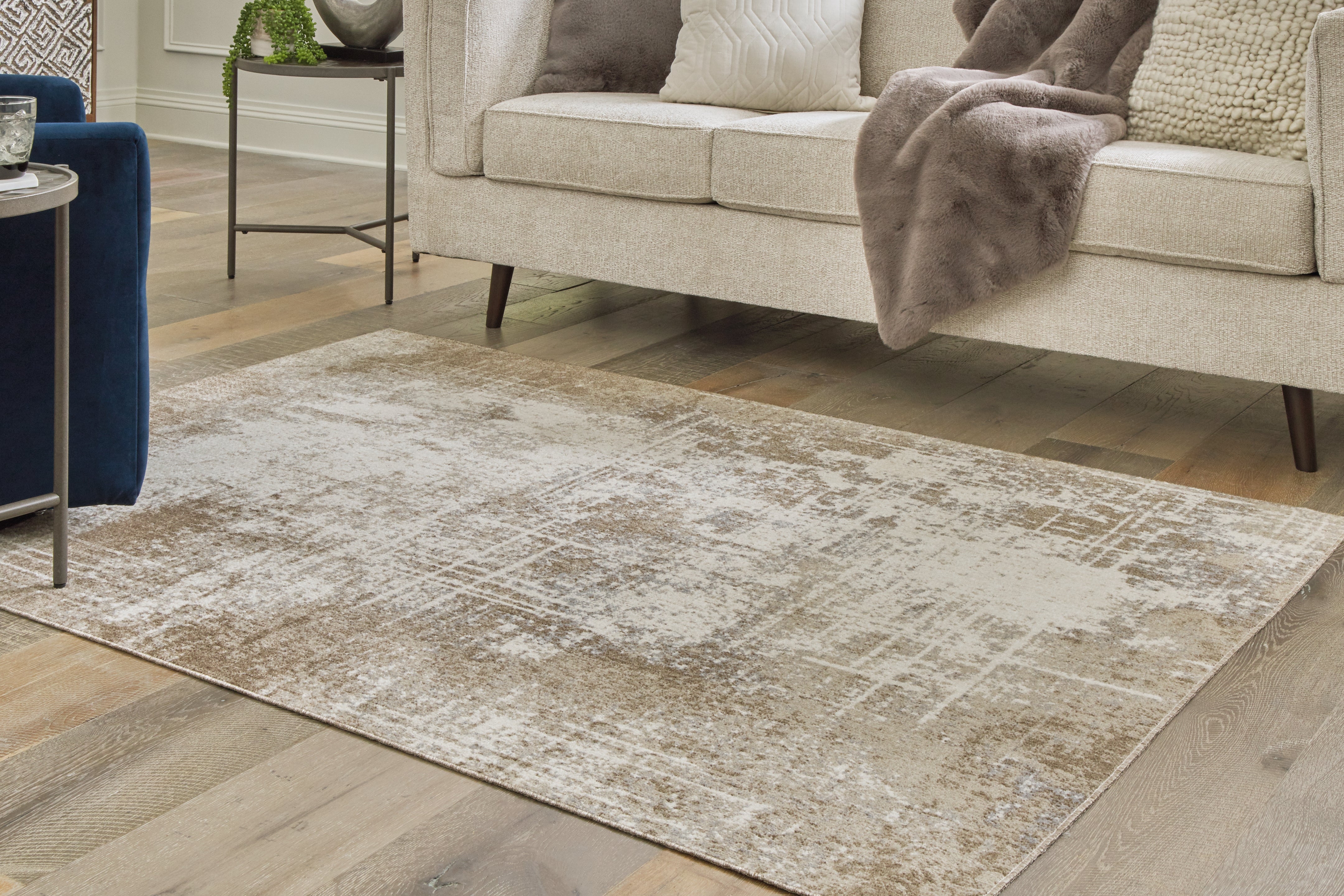 Tampa Furniture Outlet Lutz - Ashley Furniture - Grifflain Rug - 5'1" x 7' Washable Rug / Tan/Brown/Gray - R406232