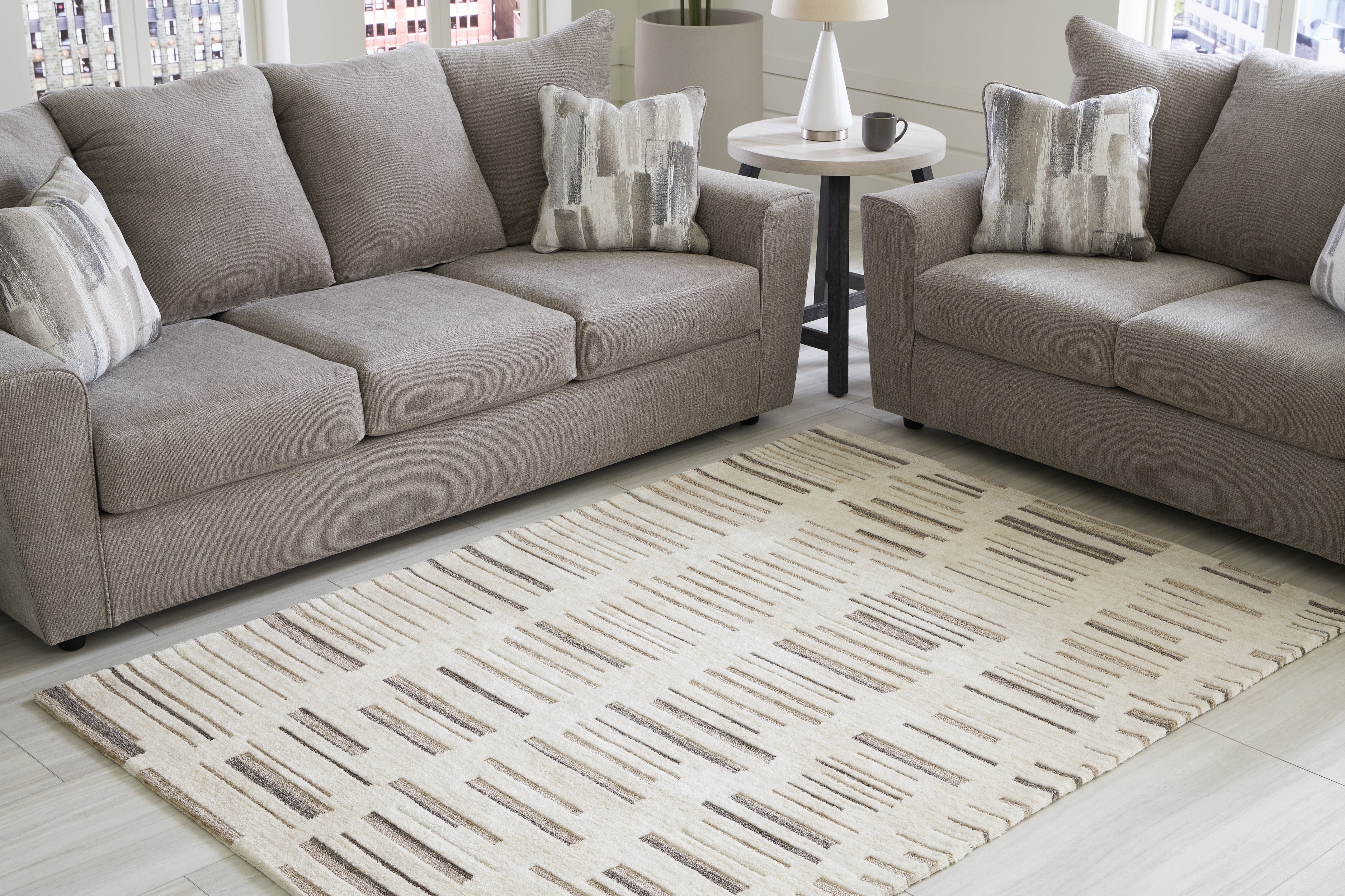 Tampa Furniture Outlet Lutz - Ashley Furniture - Leesdale Rug - 5' x 7' Rug / Ivory/Brown/Black - R406422
