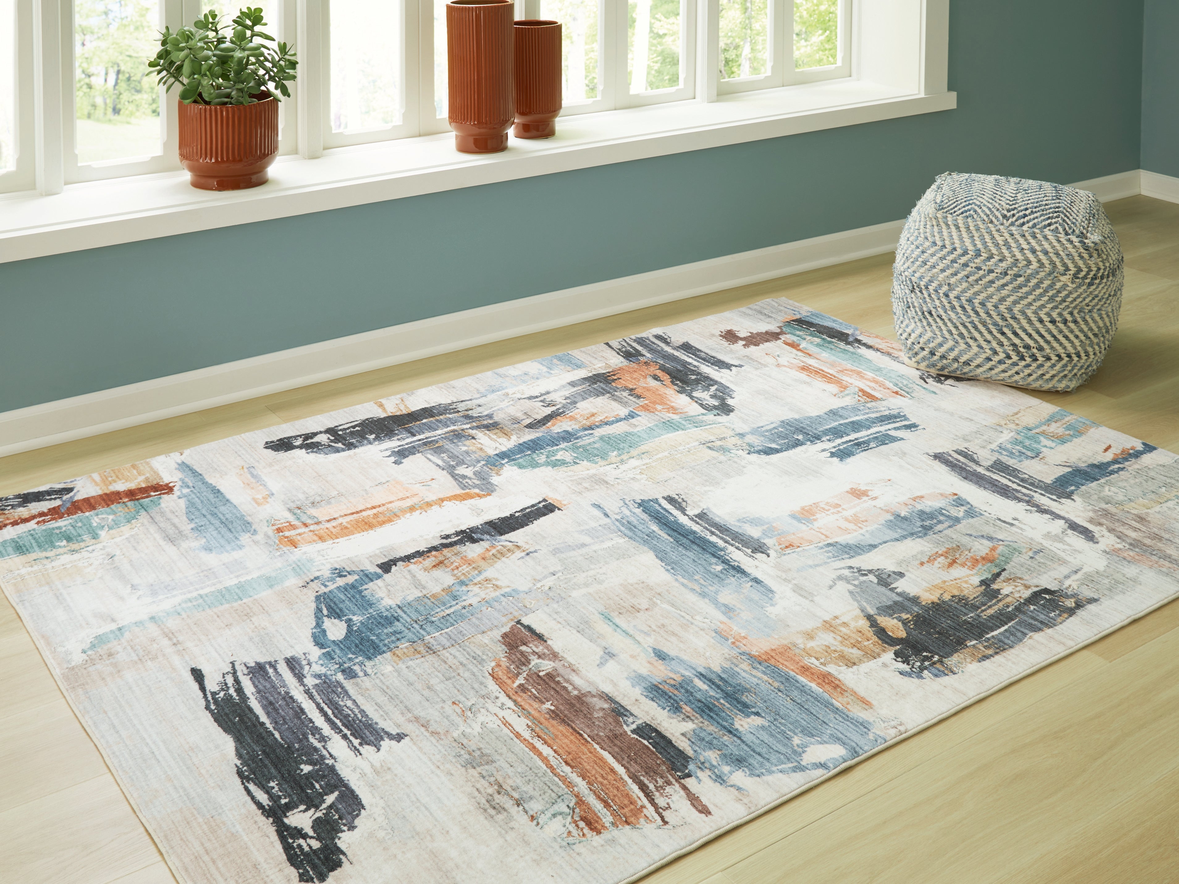Tampa Furniture Outlet Lutz - Ashley Furniture - Hessland Rug - 5' x 7' Washable Rug / Multi - R407052