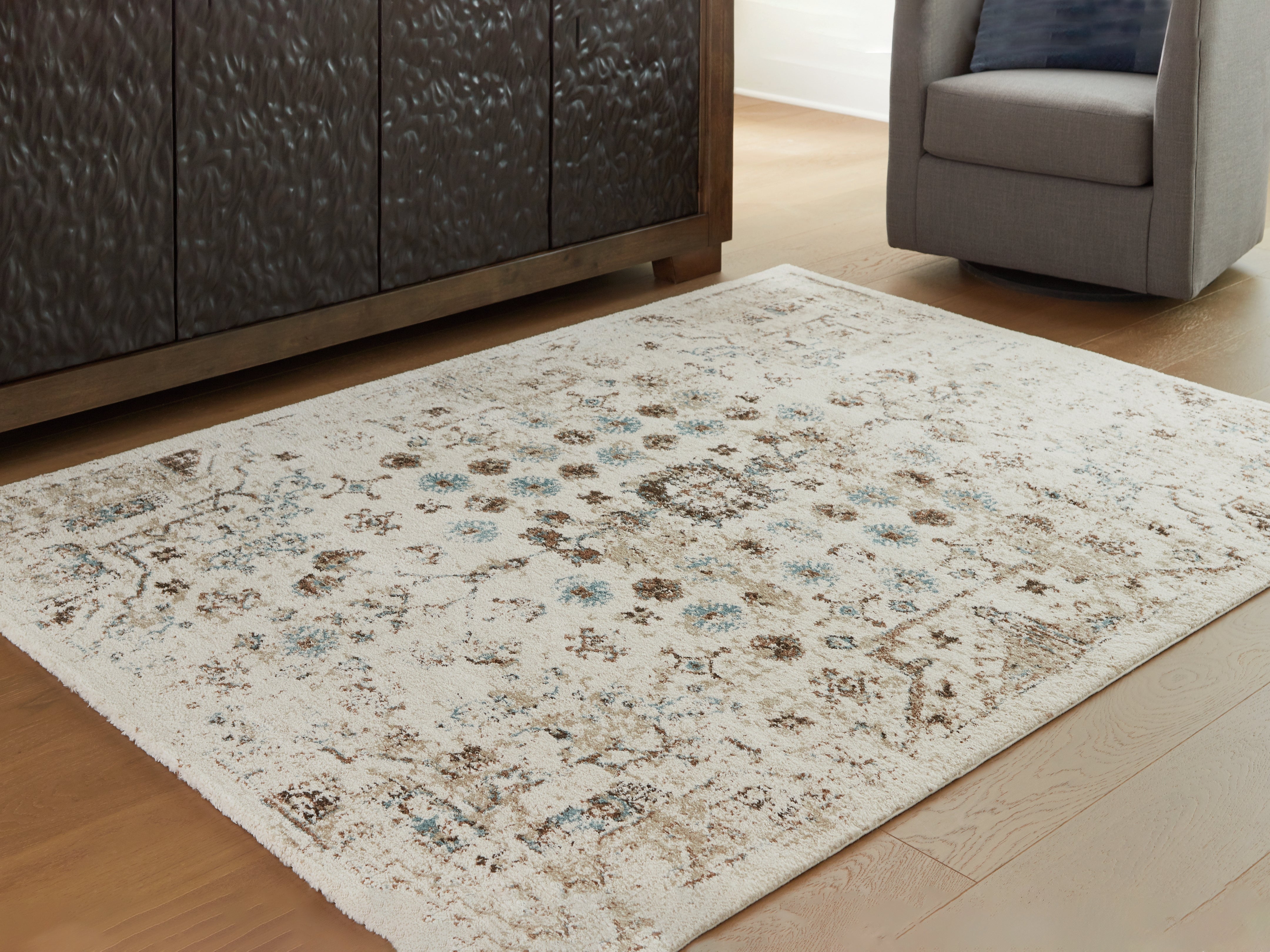 Tampa Furniture Outlet Lutz - Ashley Furniture - Jossler Rug - 5' x 7' Rug / Ivory/Brown/Teal - R407072