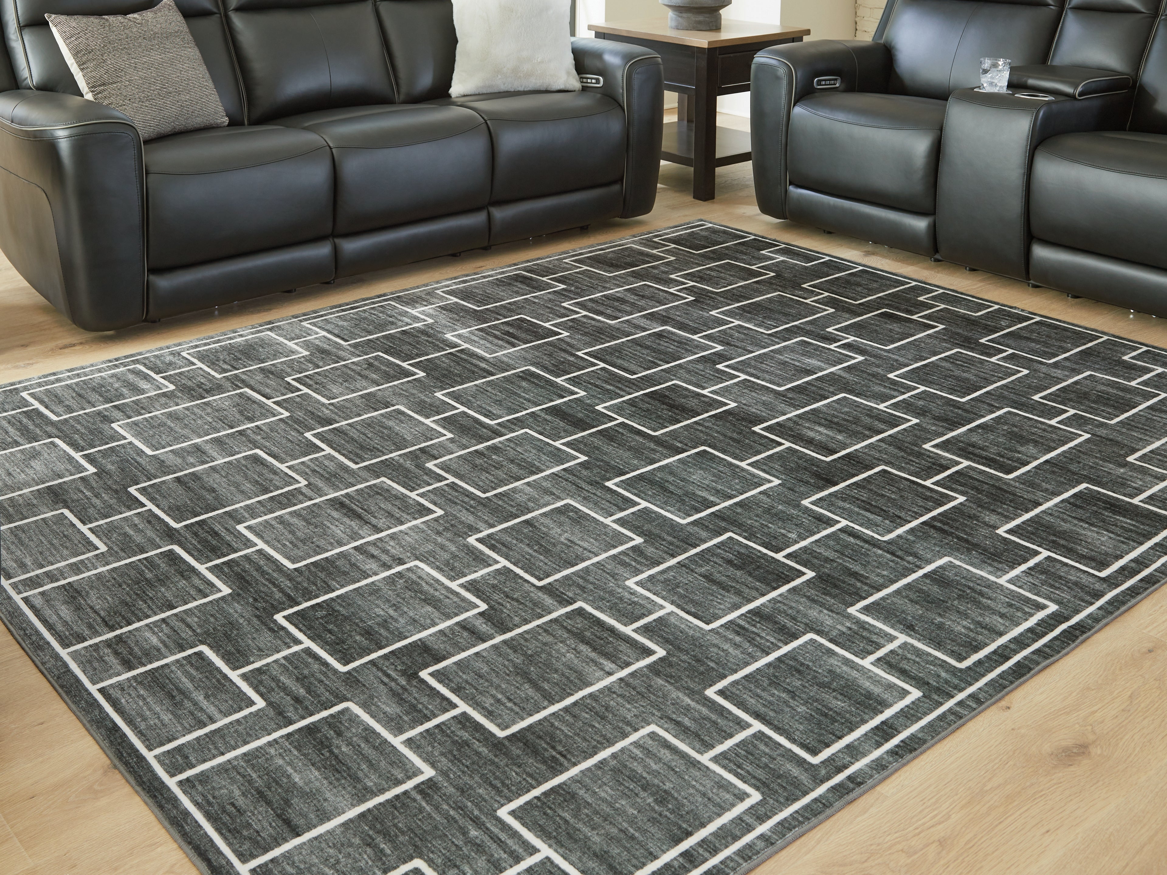 Tampa Furniture Outlet Lutz - Ashley Furniture - Elderland Rug - Washable 7'6" x 9'6" Area Rug / Black/Gray - R407401