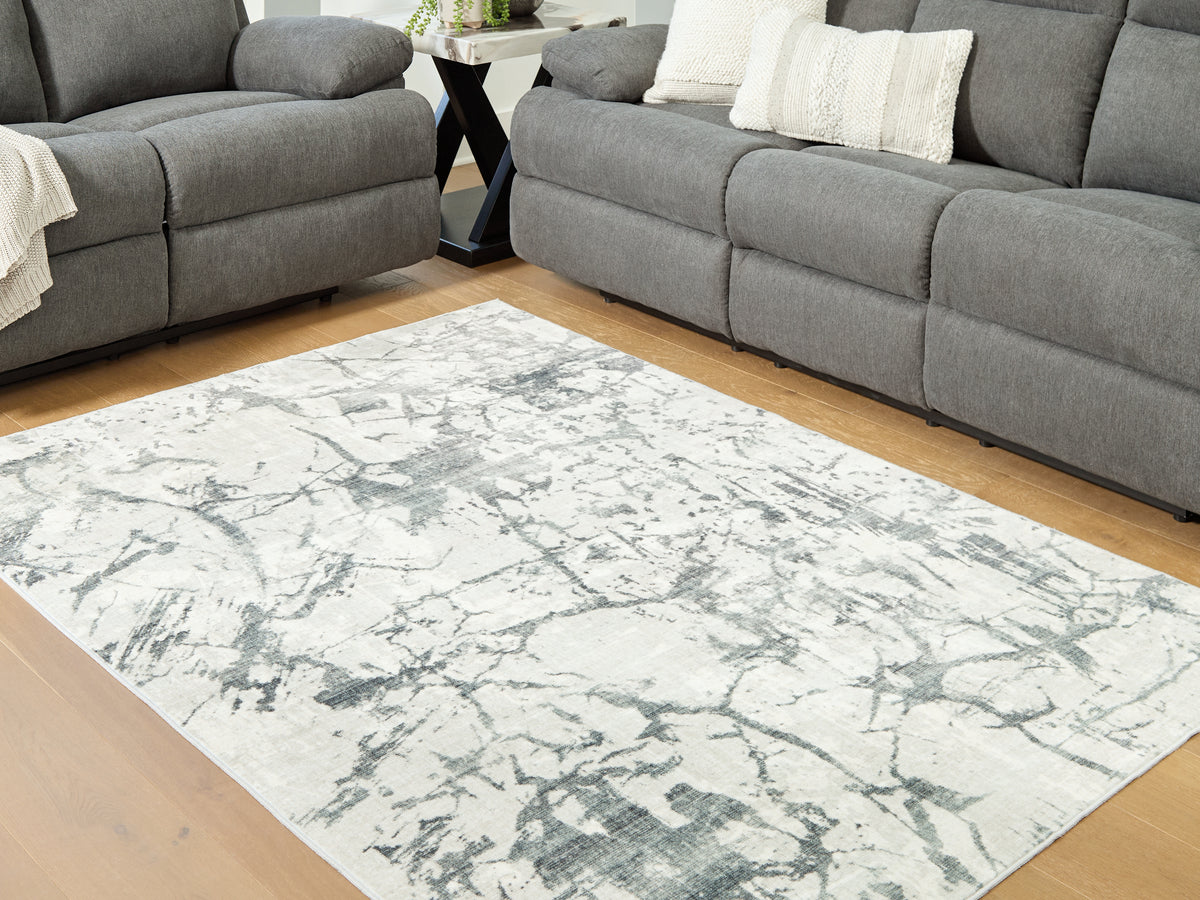 Tampa Furniture Outlet Lutz - Ashley Furniture - Tobinbury Rug - Washable 5' x 7' Area Rug / Gray - R407422