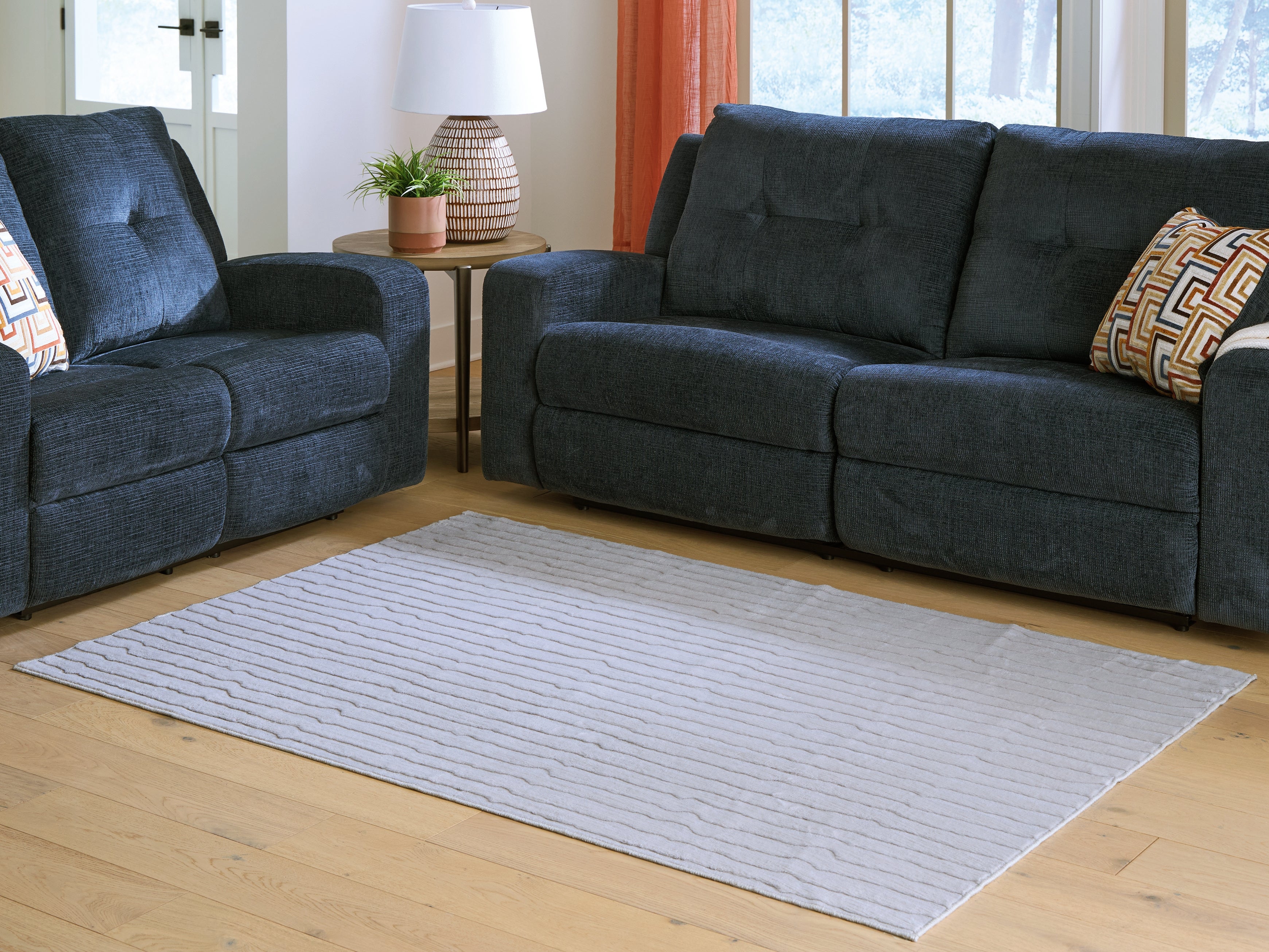 Tampa Furniture Outlet Lutz - Ashley Furniture - Worthley Rug - Washable 5' x 7' Area Rug / Gray - R407452