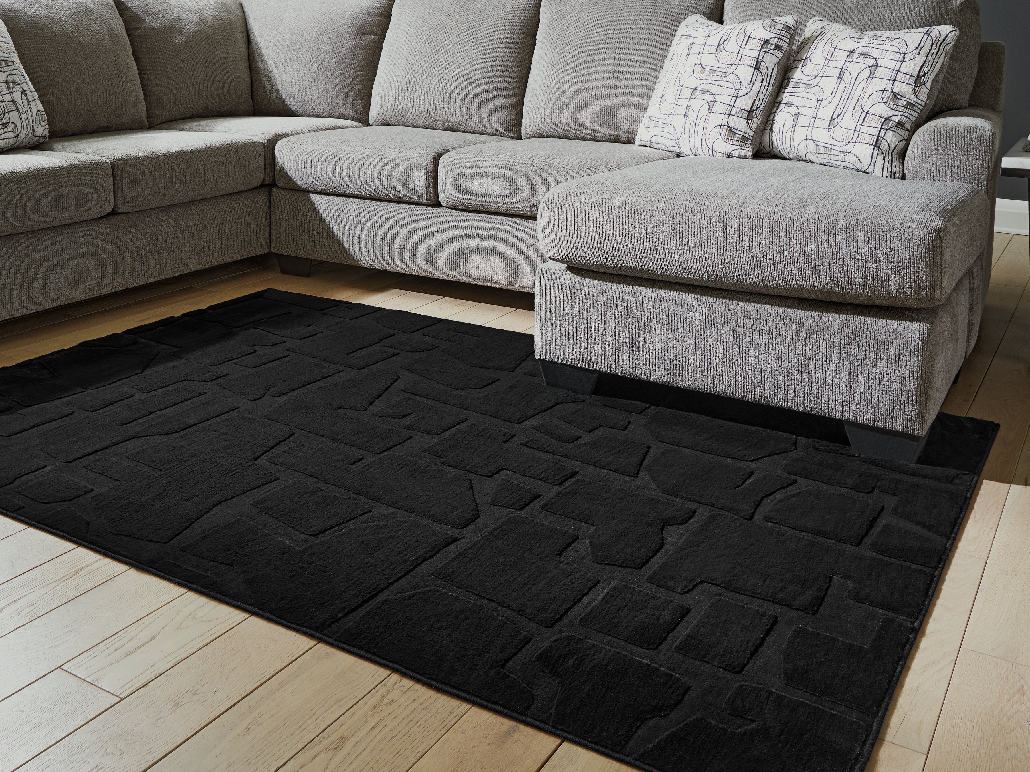 Tampa Furniture Outlet Lutz - Ashley Furniture - Gibbswell Rug - Washable 5' x 7' Area Rug / Black - R407462