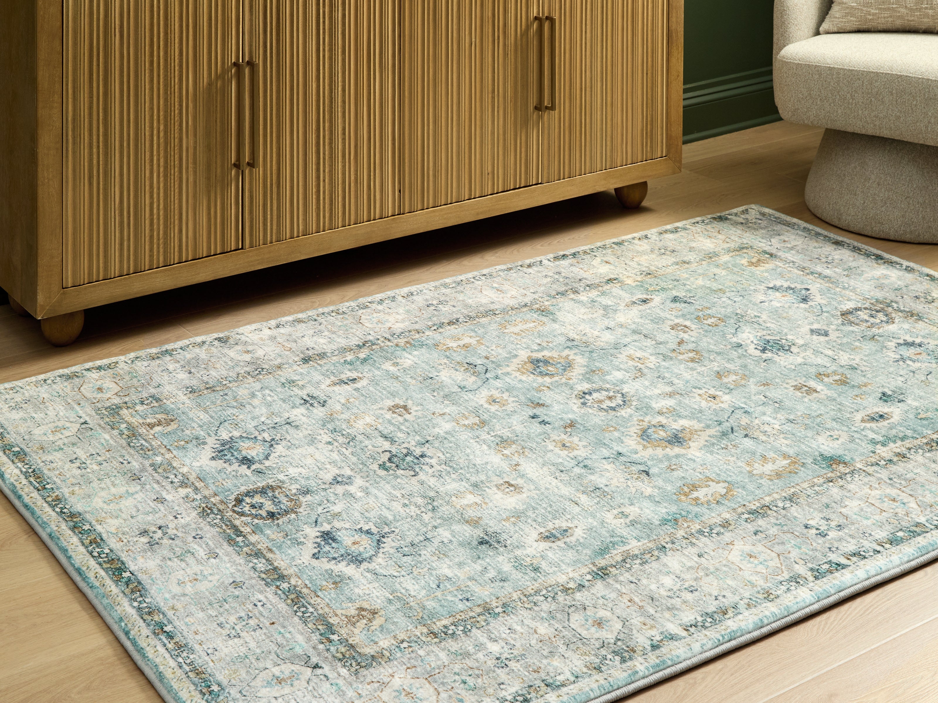 Tampa Furniture Outlet Lutz - Ashley Furniture - Ladstoney Rug - 5' x 7' Memory Foam Area Rug / Teal/Beige/Ochre - R407502