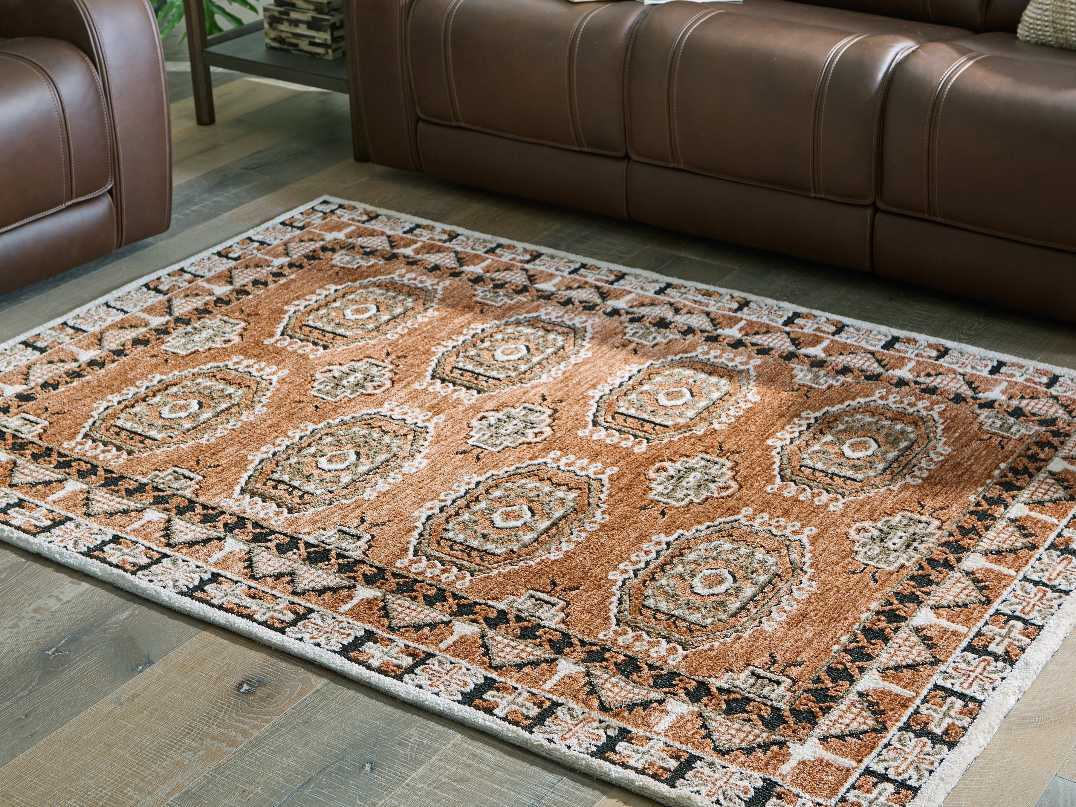 Tampa Furniture Outlet Lutz - Ashley Furniture - Qaabiz Rug - 5' x 7' Area Rug / Sienna/Ivory/Black - R407522