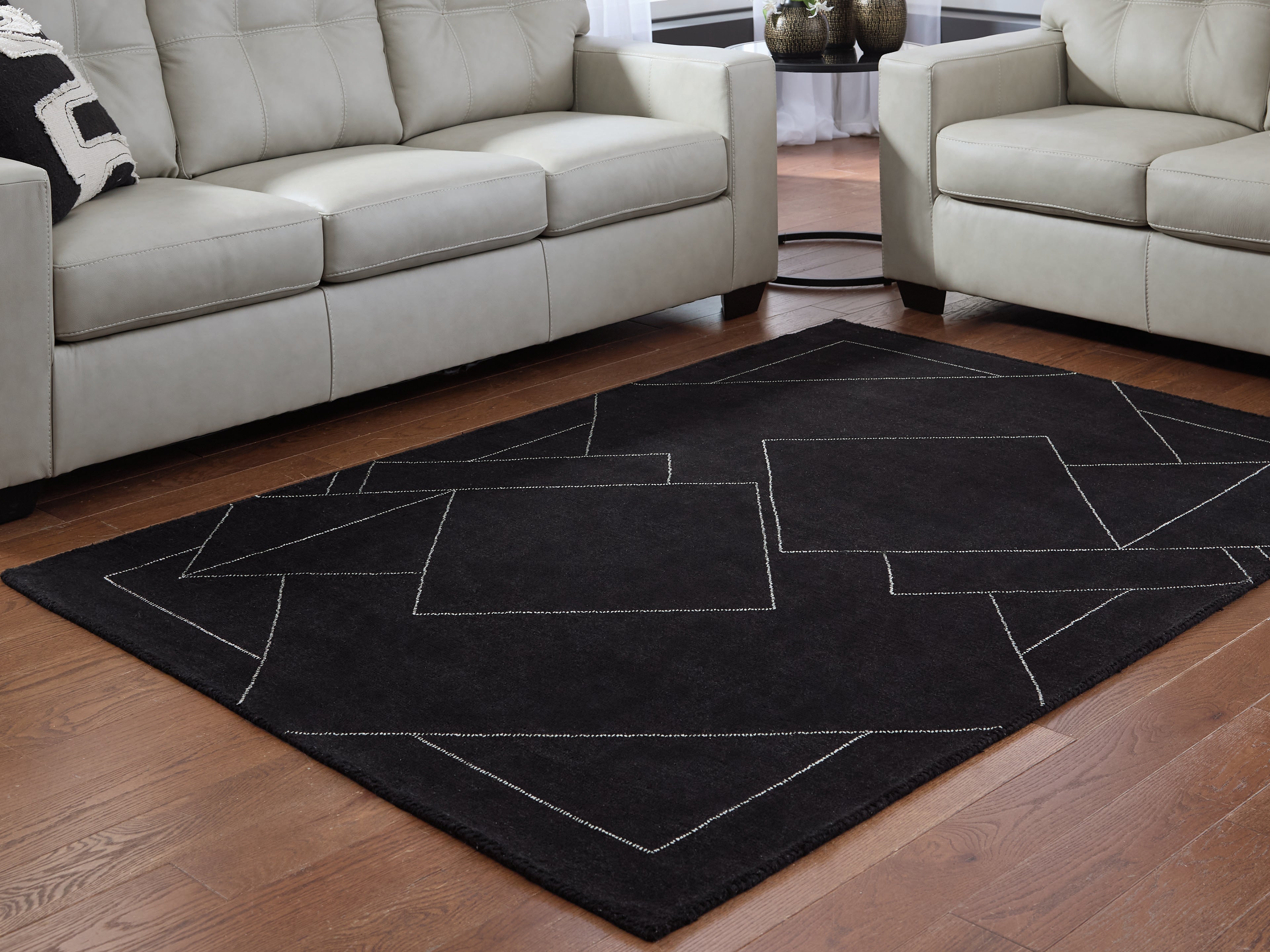 Tampa Furniture Outlet Lutz - Ashley Furniture - Marav Rug - 5' x 7' Area Rug / Black/White - R407532