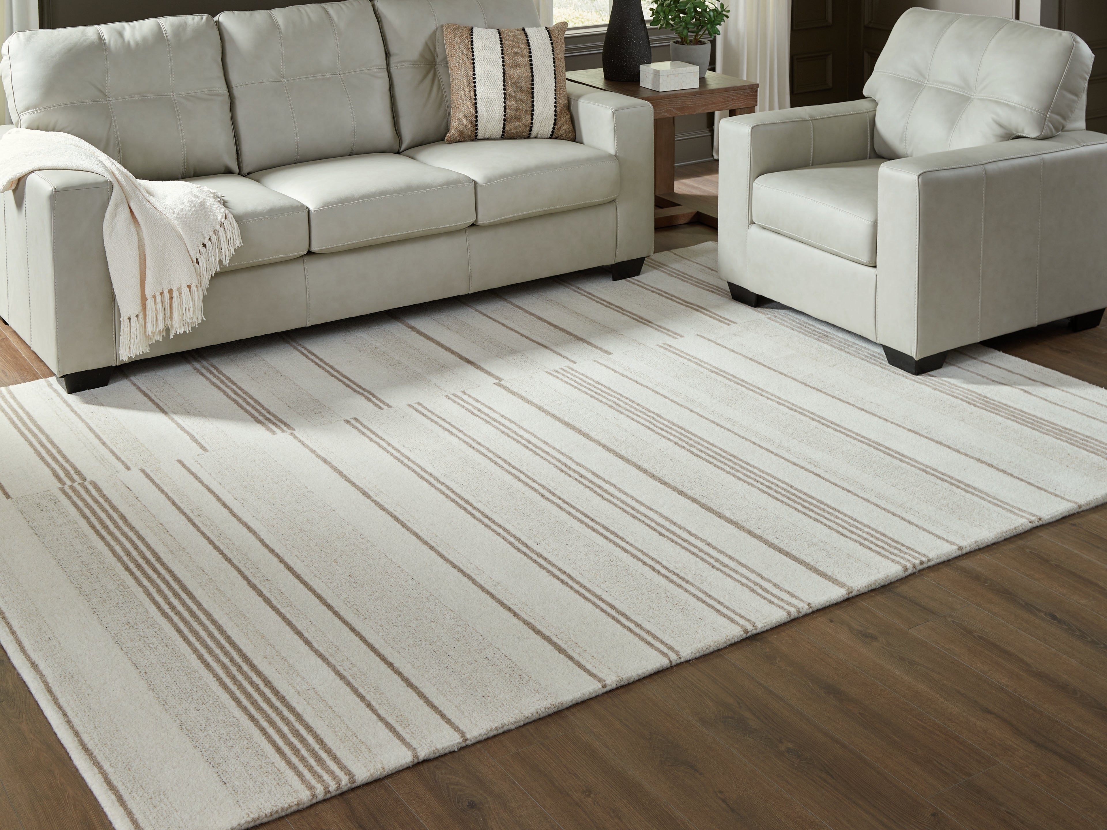 Tampa Furniture Outlet Lutz - Ashley Furniture - Gadence Rug - 7'8" x 10' Area Rug / Ivory/Tan - R407641