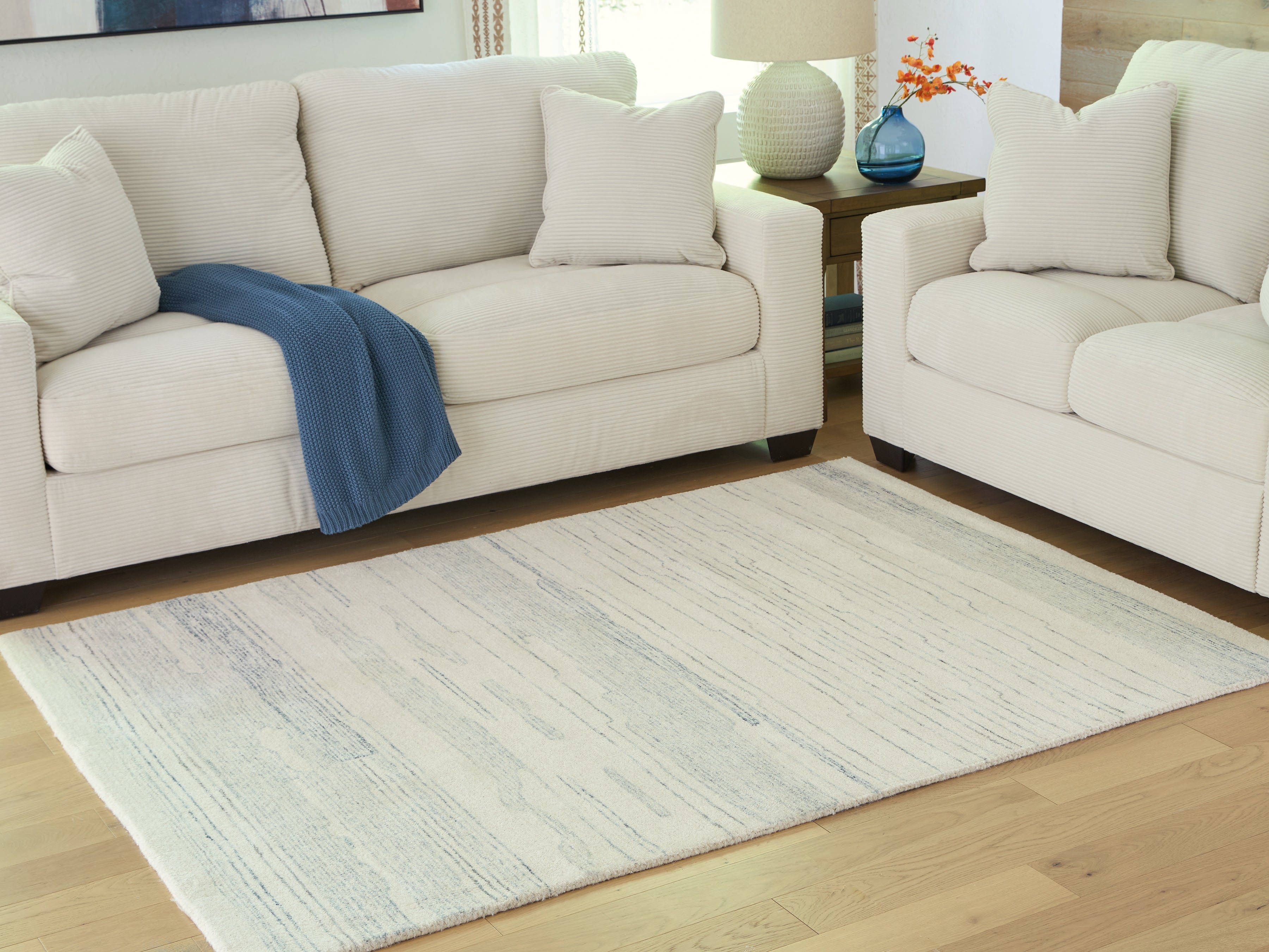 Tampa Furniture Outlet Lutz - Ashley Furniture - Genemost Rug - 5' x 7' Area Rug / Ivory/Blue - R407842