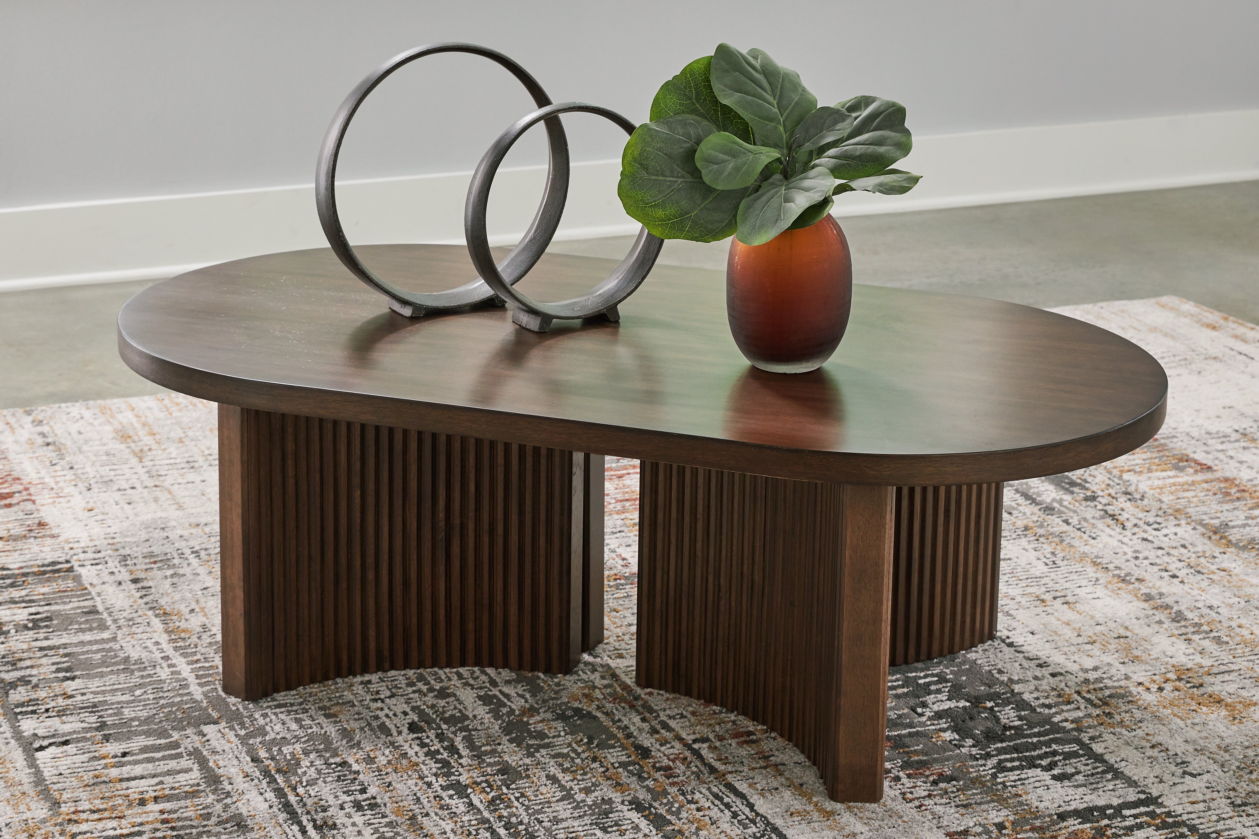 Tampa Furniture Outlet Lutz - Ashley Furniture - Korestone Coffee Table - Oval Cocktail Table / Dark Brown - T689-0
