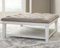 Tampa Furniture Outlet Lutz - Ashley Furniture - Kanwyn Upholstered Ottoman Coffee Table - UPH Ottoman Cocktail Table / Whitewash - T937-21